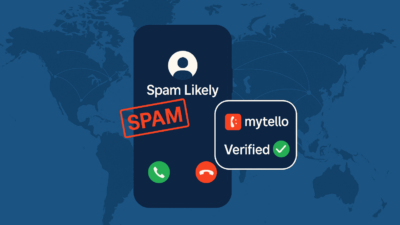 Phone screen showing a spam-labeled international call and a verified call overlayed on a world map background
